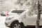 Car in the snow. snowy winter. parking cars near