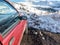 Car in a snowdrift in a dead end on a road piled with snow