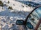 Car in a snowdrift in a dead end on a road piled with snow