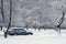 Car during a snowfall in town