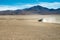 Car speeding in the desert of Bolivia