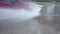 A car splashing water from a puddle of water