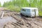 Car stuck in the muddy forest road