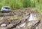 Car stuck in the muddy forest road