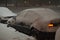 Car stuck in the snow in the parking lot