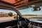 car with sunshade and water bottle, for a day of driving in the heat