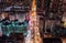 Car, taxi, and bus traffic on road intersection at night in Hong Kong downtown district, drone aerial top view. Asia city life