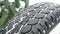 Car tire background with snow. Tyre texture closeup background