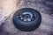 Car tire isolated on asphalt floor - car wheel change