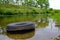 Car tire in the river environmental pollution