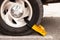 Car tire with yellow boot