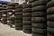 Car tires and wheels at warehouse in tire store