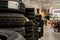 Car tires and wheels at warehouse in tire store