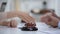 Car toy on table, woman signing vehicle purchase or insurance on background