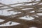 Car tracks on a snowy road. Slippery road, danger, risk of skidding. Traces of winter tire treads