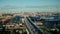 Car traffic on modern multilevel highway bridge over river water in big city