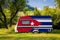 A car trailer, a motor home, painted in the national flag