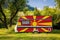 A car trailer, a motor home, painted in the national flag