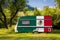 A car trailer, a motor home, painted in the national flag