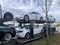 A car transporter carries new Tesla vehicles - mainly Model 3 - near the Munich Delivery Center