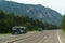 A car transporter transports new cars along a motorway in Austria, rear view of the trailer.