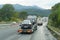 A car transporter transports new cars along a motorway in France, rear view of the trailer.