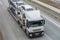 Car transporter truck transports cars on highway