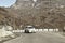 Car traveling downhill on curved mountain roads. Vehicle driving driving in a hairpin bend shoot from car. Rural Roadside. Road