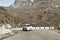 Car traveling downhill on curved mountain roads. Vehicle driving driving in a hairpin bend shoot from car. Rural Roadside. Road