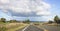 Car travelling along a rural road in New Zealand.