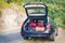 Car with trunk loaded with suitcases