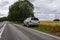 A car waiting for repair after a breakdown, a broken car on the side of the road, an emergency stop sign