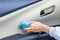 car wash and interior chemical cleaning concept.woman hand use microfiber cloth and spray to clean