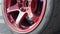 Car wheel on asphalt street racing track. Close up drift racing car in drift playground. The car is equipped with wide body kits a