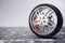 Car wheel, car tire standing on a road. Concept winter tyres. Winter tires with snowy background. Car tire with a disc