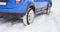 Car wheel detail in snow drifting or sliding.
