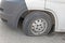 Car wheel flat tire on the road. Small white truck with punctured wheel