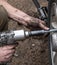 Car wheel repair. Mechanic unscrews the wheel nuts.