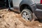 Car wheel stuck in the beach sand