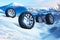 Car wheels with offroad winter tyres on snow