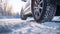 Car wheels on a snowy road. Selective focus.