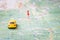 The car will drive along the road on a topographic map. A yellow toy car travels along the route to the destination point