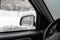 car windshield under a layer of snow