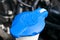Car windshield wiper cleaning spray water reservoir blue bottle cap in car engine space. Car detailing. Car inside. Installed fron