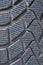 Car winter tire detail closeup, used car tires texture