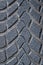 Car winter tire detail closeup, used car tires texture