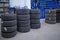 In car workshop there are many stacked car tires