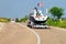 Car with yacht or motor boat at road in Sardinia