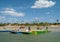 Cara crossing the river in primitive boat in Camocim, Ceara, Brazil