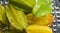 Carambola fruits in natural state on blurred background